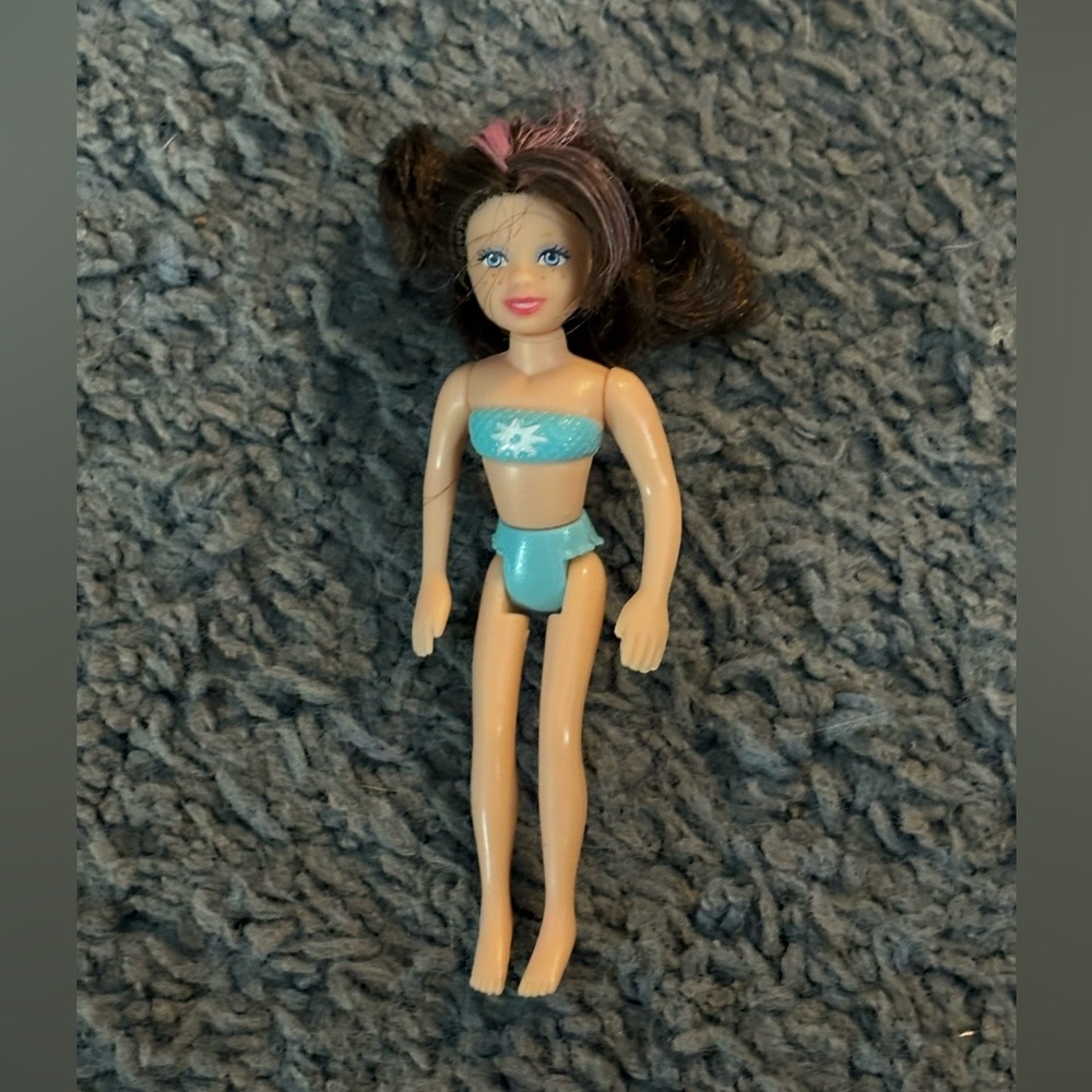 Lightly used Polly Pocket with brown & pink hair and blue undergarments